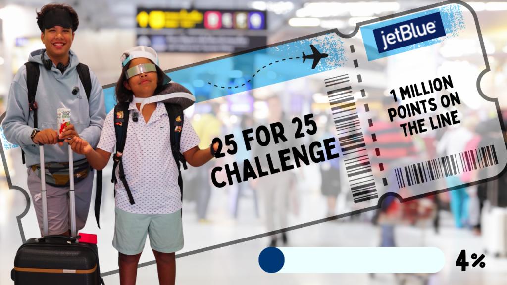 Two brothers holding JetBlue 25-for-25 Challenge sign before starting 25 flights in 30 days.